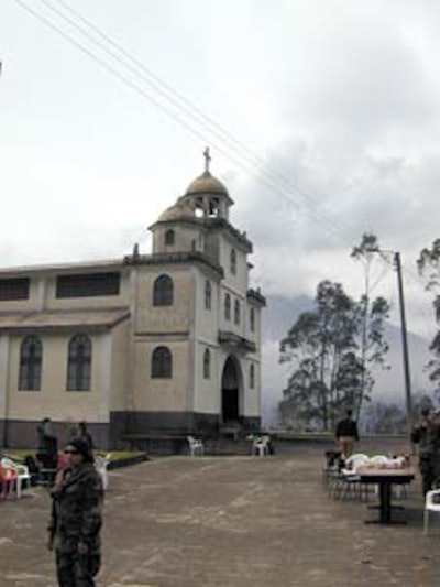 U.S. Air Force and Ecuadorian military medics establishing an outdoor clinic in Cotalo, Ecuador, following the eruption of the Tungurahua volcano in 2006. The town lost electricity, water, and sewage services as a result of the eruption.