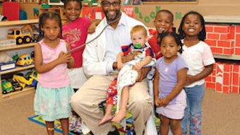 Charles E. Moore, MD with children after health education class. Dr. Moore is the 2011 Gold Foundation Award recipient for Humanism in Medicine. Photo courtesy of Jim and Tamie Lyles.