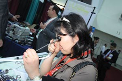 An attendee tries out a scope during the annual meeting.