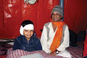 Father and son after tympanomastoidectomy.