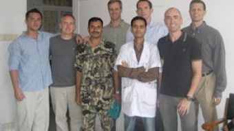 Operation Sight, Sound, and Smile team (front l. to r.) Scott Roofe, MD, Nepalese medical resident, member of Nepalese Army, Michael Turner, and Mitchell Stone. (back l. to r.) Scott Croll, MD, Eric Wirtz, MD, and Dave Healy, MD.