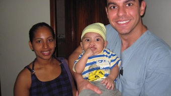 Dr. Azzi, preoperatively with a cleft-lip patient.