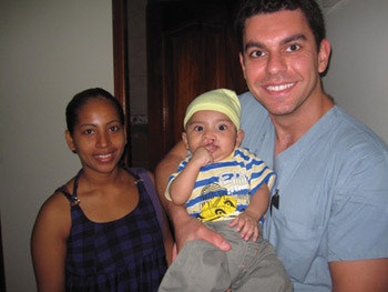 Dr. Azzi, preoperatively with a cleft-lip patient.