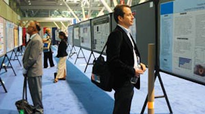 Attendees at the 2010 Annual Meeting view poster presentations.