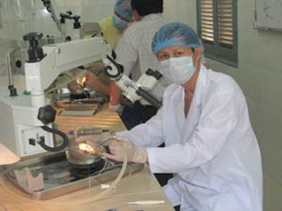 A Cambodian otolaryngologist practicing temporal bone dissection in the new laboratory