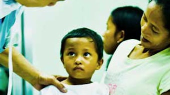 A 4-year-old boy in pre-operative area waits for a thyroglossal duct cyst excision