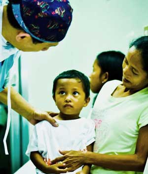 A 4-year-old boy in pre-operative area waits for a thyroglossal duct cyst excision