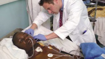 Dr. Royer on post-operative ICU rounds caring for a 25-year-old patient after resection and pectoralis flap reconstruction of a large facial mass.