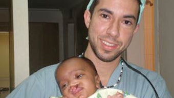 Team member Joseph Rousso, MD, with pre-op complex cleft-lip patient.