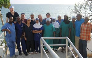 Group picture of surgeons, anesthesiologists, and operating room nursing staff outside the operating room on the last day of the ear surgery course at Mnazi Mmoja hospital in Zanzibar, Tanzania. (Dr. Zafereo at top left).