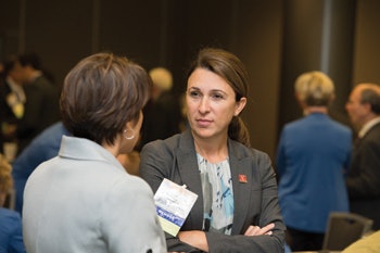 Members Lauren S. Zaretsky, MD, and Sonya Malekzadeh, MD, chat between comittee sessions.
