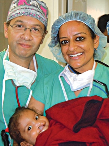 Facial Plastic Surgeon Joseph Rousso, MD, with a patient recovering post cleft lip repair. Here she is blowing bubbles for the first time.
