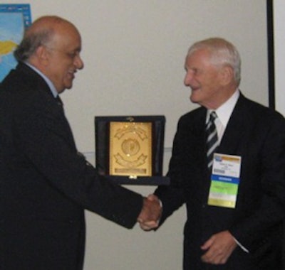 Prof. Khalifa congratulates Dr. Myers.