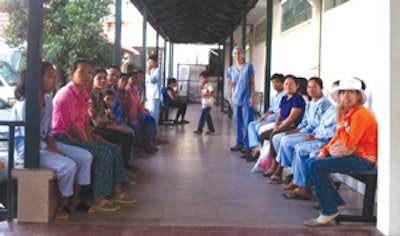 Dr. Grewal stands with patients waiting for surgery.