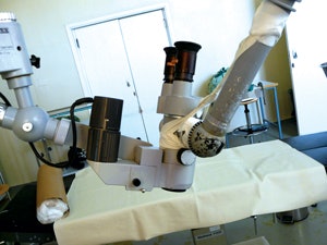 The 30-plus-year-old Zeiss microscope Dr. Yilikal performs otologic surgery with. Fancy taping maneuvers were required to correctly position the teaching arm of the microscope.