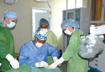 The surgical team performing a tympanoplasty. From right to left, Drs. Calzada, Yilikal, and Mallon. In the background are junior otolaryngology residents from Addis Ababa.