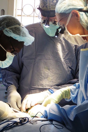 Performing a thyroidectomy with one of the Kenyan otolaryngologists: L-R: Titus Sisenda, MMed, Bruce Campbell, MD, Susan Cordes, MD, and Clinical Officer Charles Alisoreng.