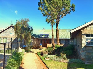 Photograph taken of the CURE hospital with a small clinic, four operating rooms, 20+ bed capacity wards.