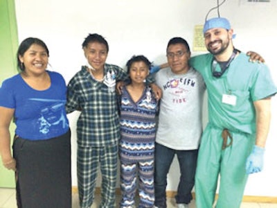 Brothers with microtia, their parents, and Dr. Kopelovich.