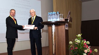 Eugene N. Myers, MD, presenting a proclamation from AAO-HNS to Prof. Virgilijus Ulozas, president of the sixth Baltic Congress.