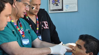 Team evaluation of a clinic patient during surgical screening. Left to right: Jeffrey Watson, MD, Russell Kridel, MD, J. Charlie Finn, MD.