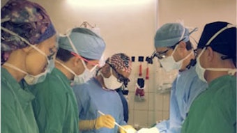 Team leader Dr. Dhingra takes residents through a thyroidectomy procedure.
