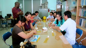Vietnamese residents working together on the marshmallow challenge