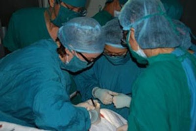 Sharon H. Gnagi, MD, operating with local Vietnamese residents.