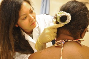 Post-operative clinic, follow-up visit for ear reconstructive surgery.