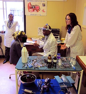Preparing to perform a tonsil biopsy of a patient with an exophytic mass. From left to right: Dr. Mlambo, Dr. Dzongodza, and Dr. Czechowicz.