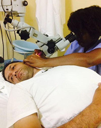 Examining a patient in the clinic.