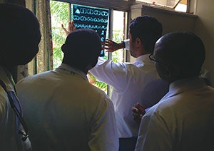 Radiology rounds on the wards. From left to right: Dr. Innocent, Dr. Divi, and Dr. Katurura.