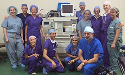 Part of the brigade posing with the new anesthesia machine. Foreground: Mark Varvares MD. Row 1 (L to R): Nancy Nguyen, AA, Dary Costa, MD, Julie Fitzer, AA. Row 2 (L to R): Mary Czerny MD, George Saffa, Lisa Schaeg NP, Nathan Hahn MD, Erica Sher, Morgan Crow RN, Haley Medvick PA, Janassa Opichka CRNA