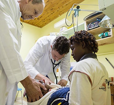 Drs. Kirschner (left) and Dobratz conduct a pre-operative evaluation.