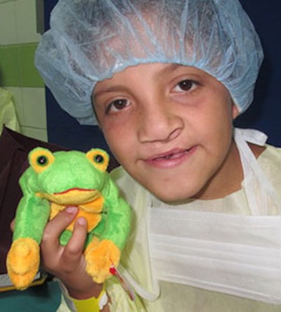 Jose showing us his frog toy as he is getting ready for surgery.