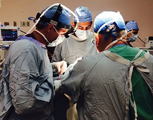 Matthew Pierce, MD, Robert M. Brody, MD, and Richard Wagner, MD, operate at LBJ Tropical Medical Center, Pago Pago, American Samoa, during a Global ENT Outreach (GEO) trip August 2015. With a high incidence of hearing loss and a high prevalence of diabetes, 6 percent to 10 percent of American Samoa’s population suffers from some form of otologic disorder. The group performed 20 otologic cases including tympanomastoidectomy for cholesteatoma, stapedectomy and ossicular chain reconstruction, and tympanoplasty for persistent tympanic membrane perforations with associated hearing loss.
