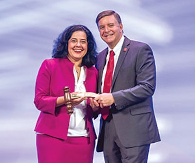 In an Opening Ceremony moment, AAO-HNS/F President Sujana Chandrasekhar, MD, (left) received a Past President’s gavel and pin from new President Gregory Randolph, MD.