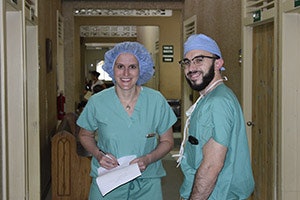 Brittany Weber, MD, and Ben Rubinstein, MD, prepare postoperative orders at Loma de Luz after performing a thyroidectomy.