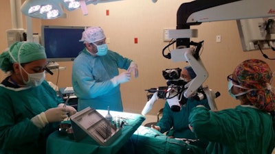 James E. Saunders, MD, intraoperatively teaching Nicaraguan residents and physicians.