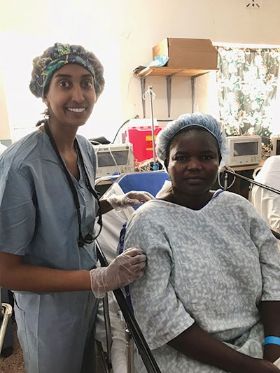 Neela Rao, MD, stands with a patient before surgery