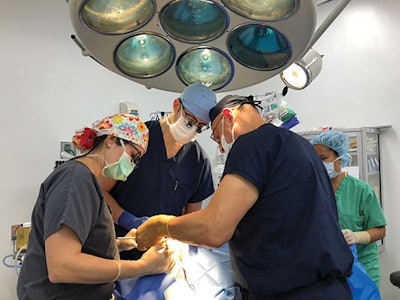 The Global Smile Foundation surgical team performing a cleft lip repair. From left to right: Laura Hetzler, MD, Alexander Marston, MD, and Usama Hamdan, MD