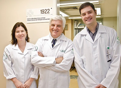 Dr. Leticia Schmidt Rosito and Dr. Mauricio Noschang flank Dr. da Costa