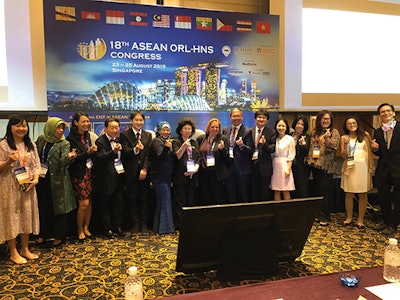 AAO-HNSF Joint Meeting: 18th ASEAN ORL-HNS Congress, August 23-25, in Singapore. Attendees at the gala dinner demonstrate the popular Korean gesture, the fingerheart (the thumb and index finger form the shape of the heart).