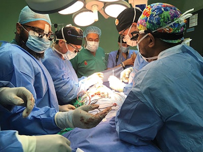 Marcus Mirambeaux, MD, of the Dominican Republic and Christopher Hartnick, MD, of MEEI conducting a slide tracheoplasty.