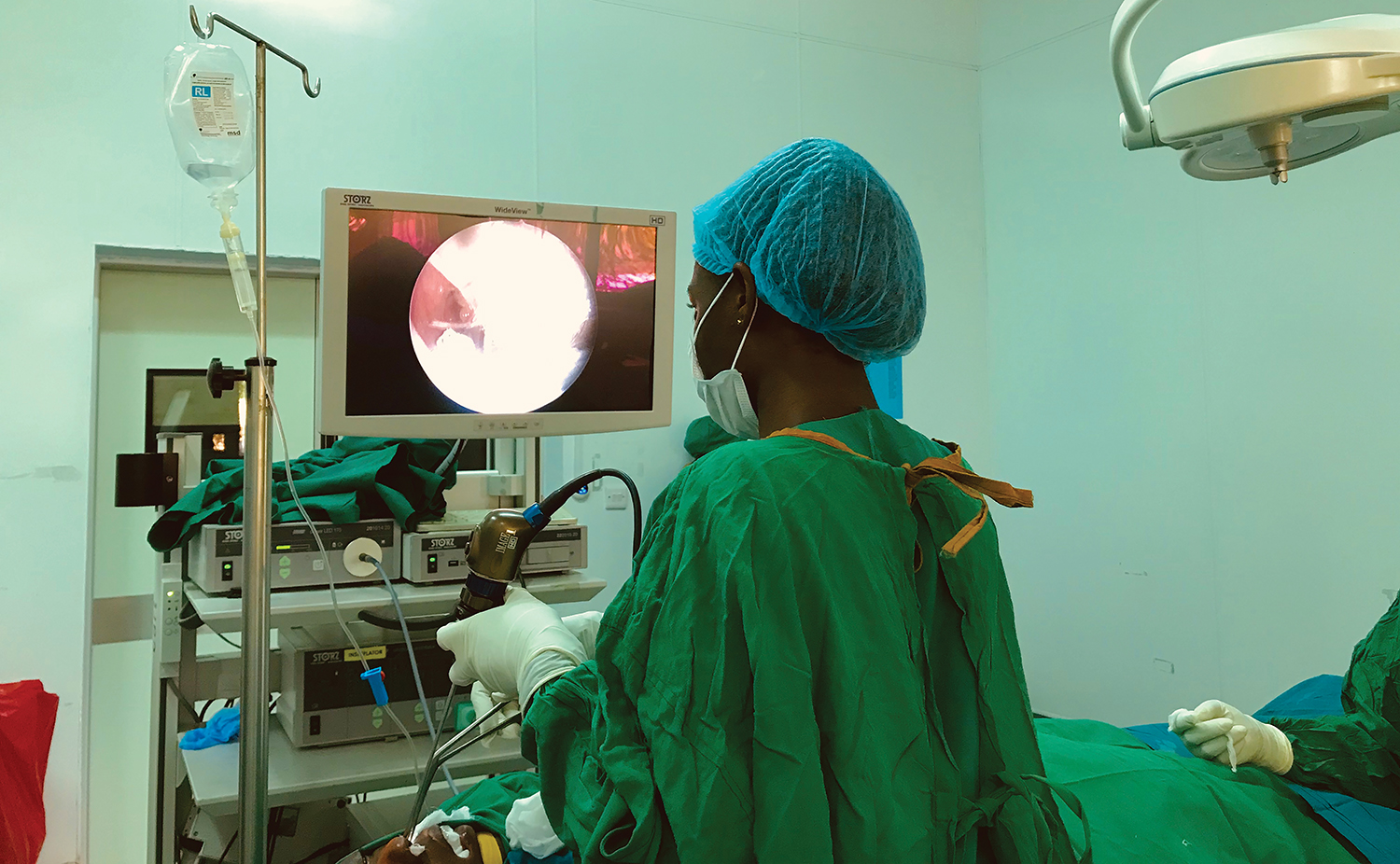 Muhimbili University of Health and Allied Sciences senior resident in the operating room performing a functional endoscopic sinus surgery.