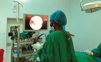 Muhimbili University of Health and Allied Sciences senior resident in the operating room performing a functional endoscopic sinus surgery.