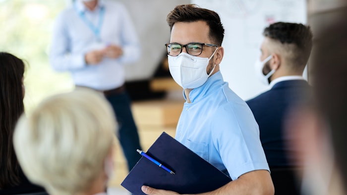 meeting professional in a mask