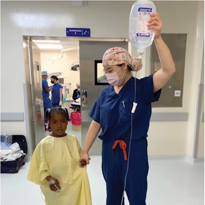 Dr. Sara Yang leading a patient into the operating room