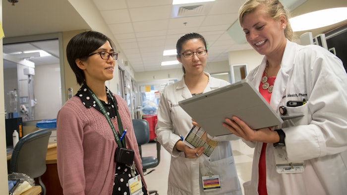 Group of medical professionals talking in hospital setting