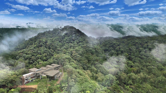 Mashpi Lodge is nestled in the Mashpi Nature Reserve in the Ecuadorian Andes. Guests experience the beauty of the rainforest via floor-to-ceiling windows throughout the spacious rooms and lounge areas.